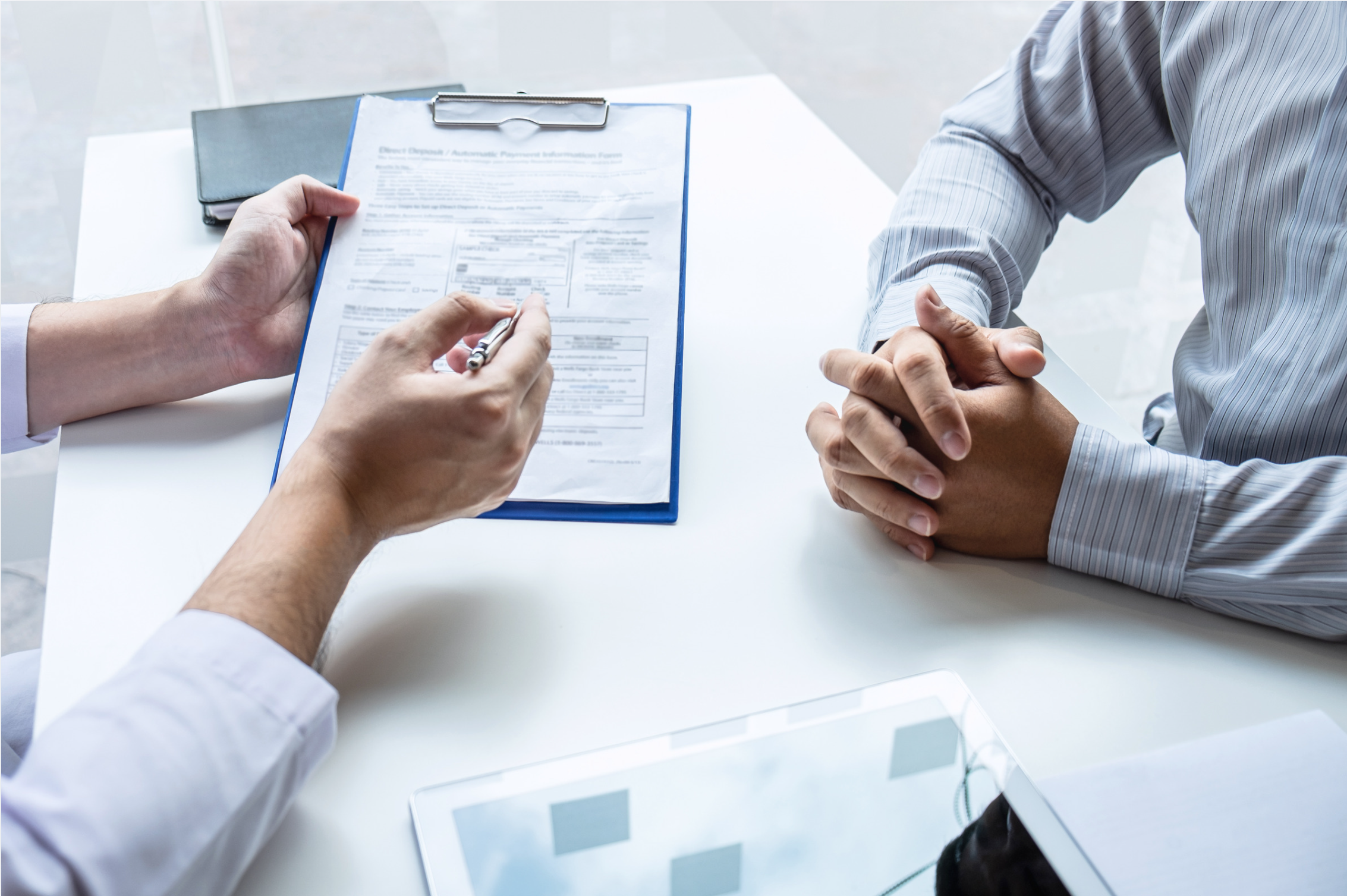 person holding clipboard with document